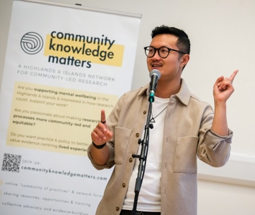 Photo of Lewis HoPhotograph of Lewis Hou at a Community Konwledge Matters in person meeting. Image credit to Alexander Williamson - www.alexander-williamson.com